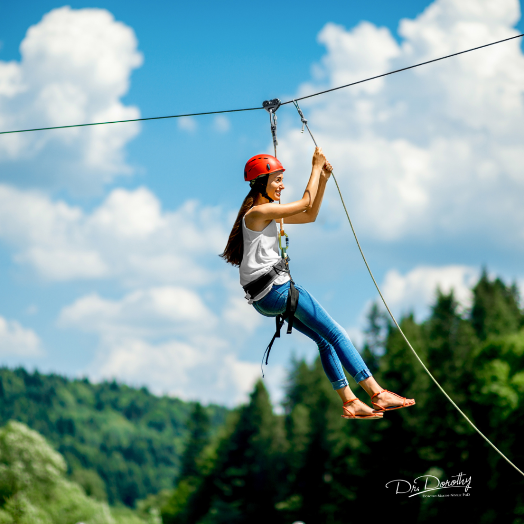 Woman ziplining even those she is afraid